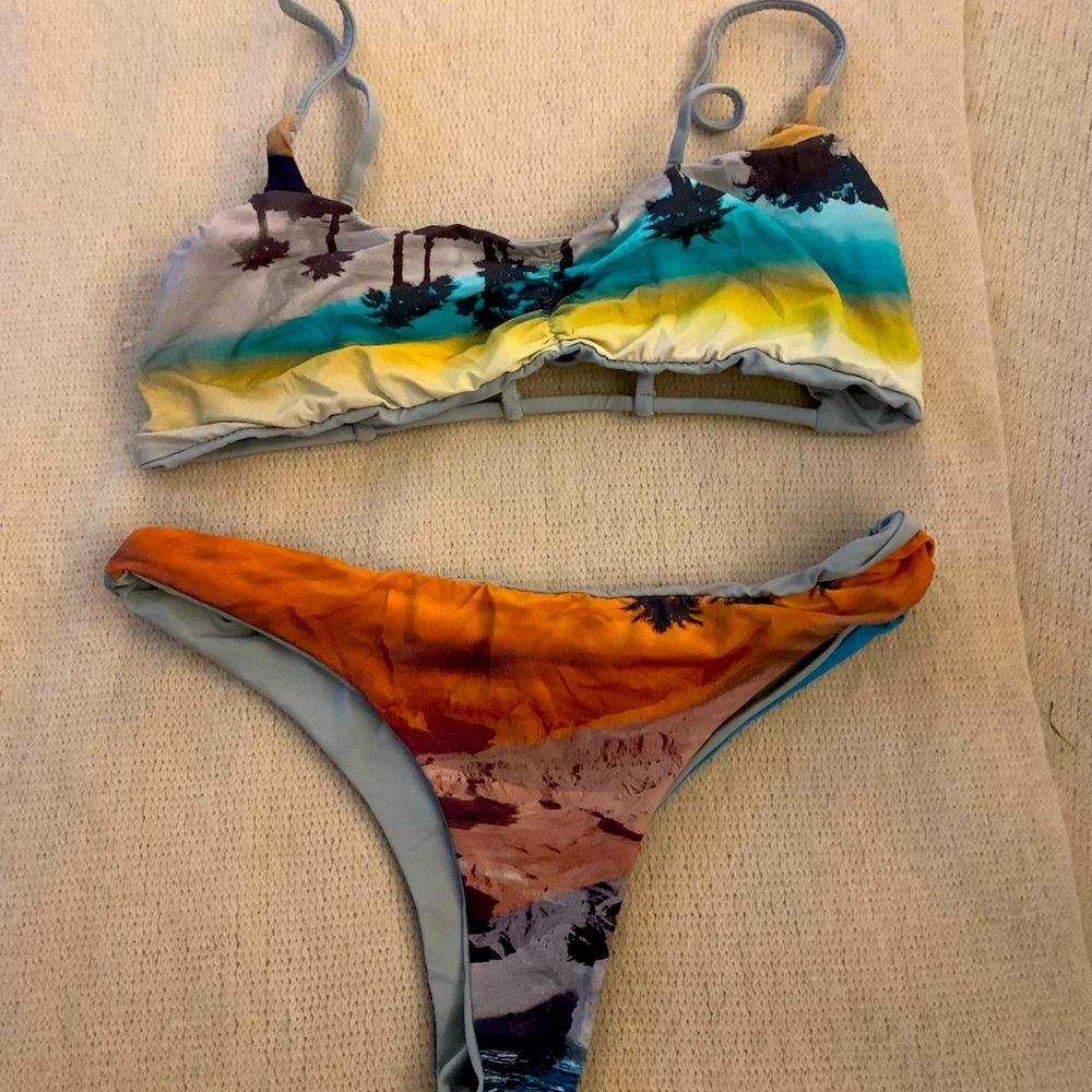Matching two-piece bikini. Perfect condition. Reversible.